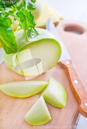 Image of Cabbage kohlrabi on Wooden Kitchen Board