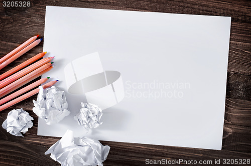Image of paper on wooden background