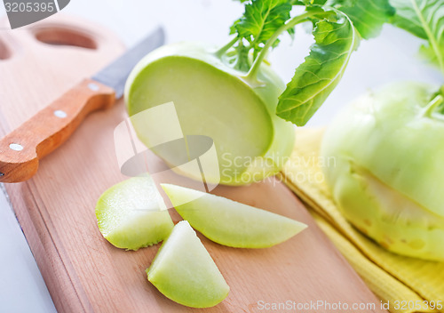 Image of Cabbage kohlrabi on Wooden Kitchen Board