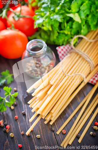 Image of raw pasta with tomato