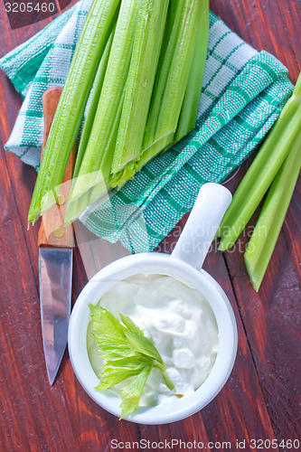 Image of fresh celery and white sauce