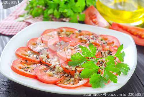 Image of tomato with basil and garlic