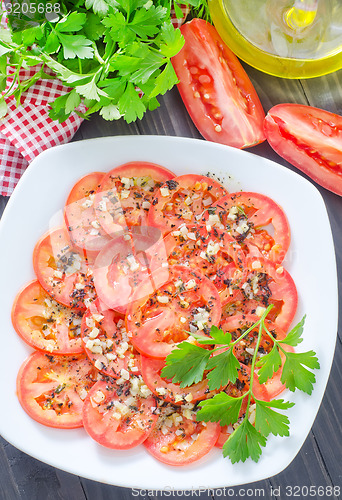 Image of tomato with basil and garlic