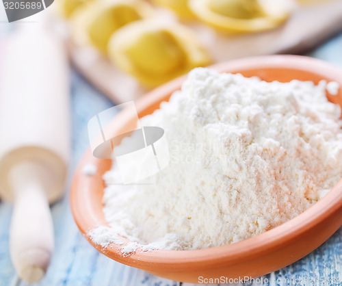 Image of flour and raw pelmeni