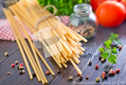 Image of raw pasta with tomato