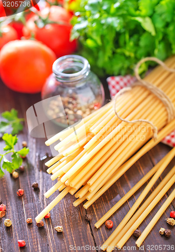 Image of raw pasta with tomato
