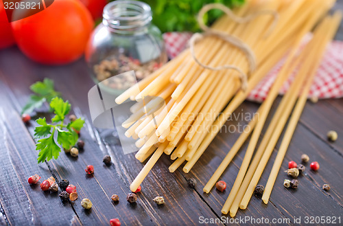 Image of raw pasta with tomato