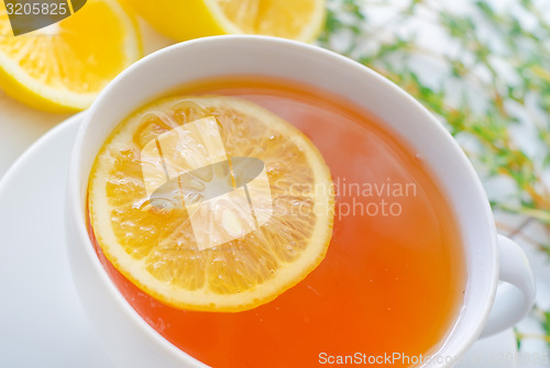 Image of Fresh tea with lemon in the white cup