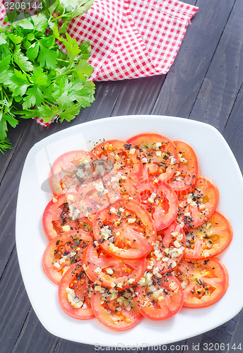 Image of tomato with basil and garlic