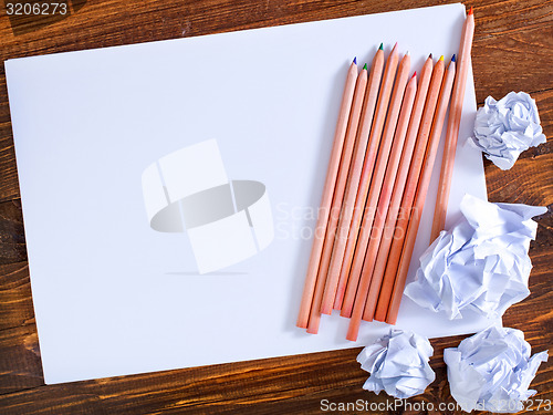 Image of paper on wooden background