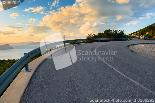 Image of Beautiful coastal road at sunset