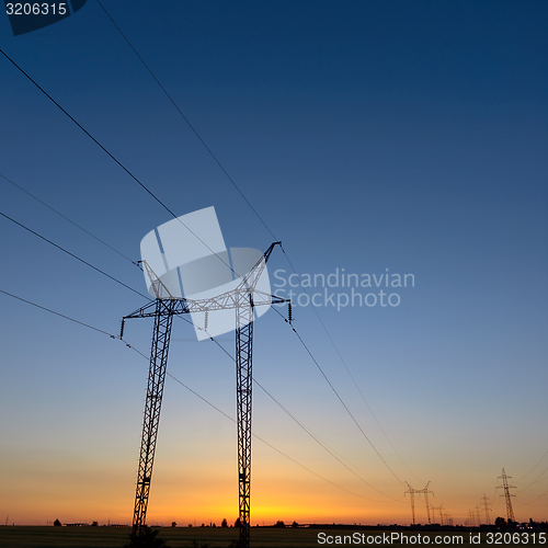 Image of Large transmission towers at blue hour 