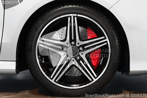 Image of New car tyre closeup photo