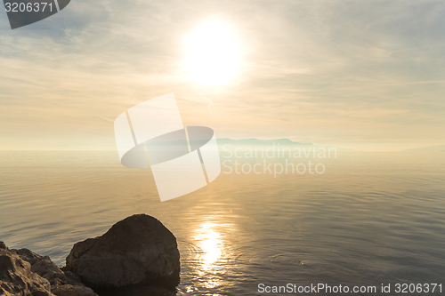 Image of Beach with rocks and a cloudy sky