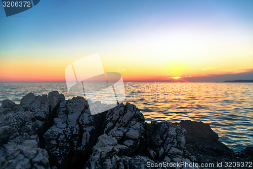 Image of Beach with rocks and a cloudy sky