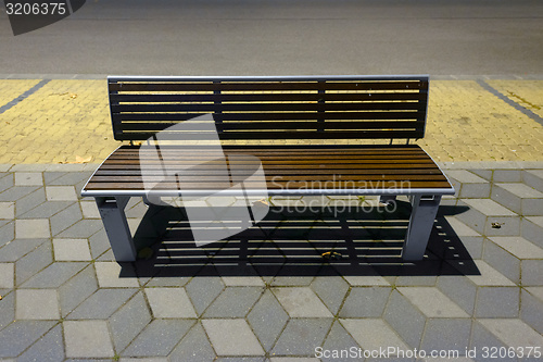 Image of Modern bench on the sidewalk