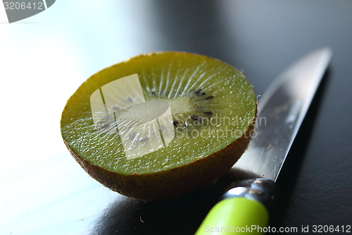 Image of Eating kiwi