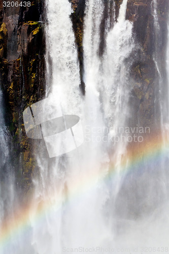 Image of The Victoria falls with rainbow on water