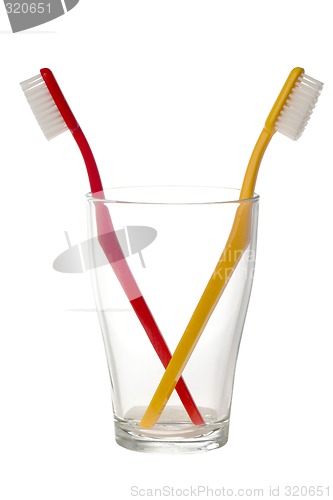 Image of Two toothbrush in a glass

