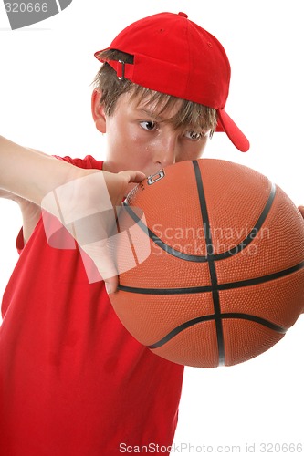 Image of Boy playing basketball