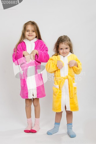 Image of Two girls in gowns depict bunnies