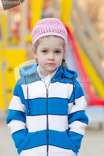 Image of Portrait a four-year girl on background of playground