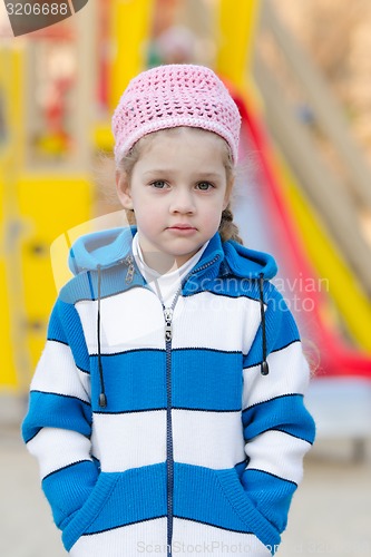 Image of Portrait a four-year girl on background of playground