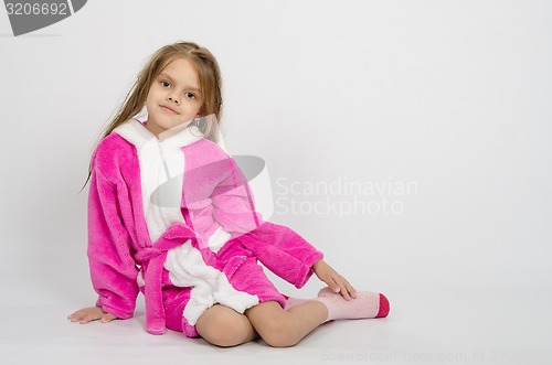 Image of Six year old girl in a bathrobe