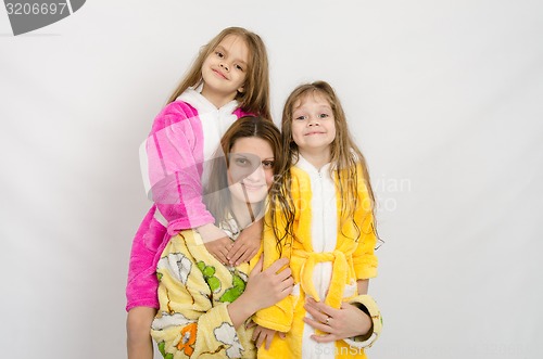Image of Portrait of a mother and two daughters in bath robes