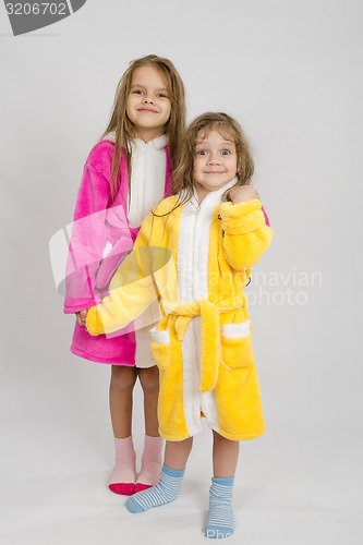 Image of Two girls standing in robes