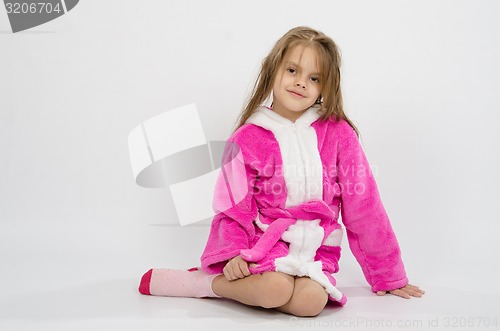 Image of Six year old girl in a bathrobe