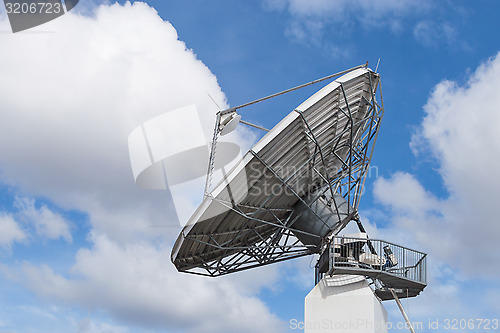 Image of Big radar parabolic radio antenna global information data stream