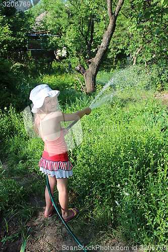 Image of girl watering a kitchen garden