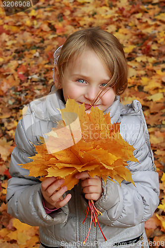 Image of little girl with leaves