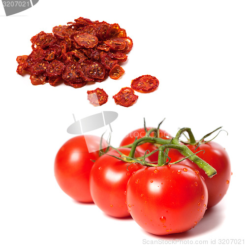 Image of Ripe tomato on bunch and dried slices of tomato