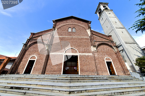 Image of cardano al campo   the old   church   brick tower sidewalk italy