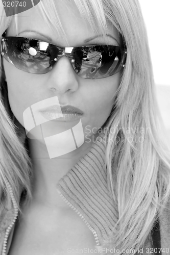 Image of Woman posing in sunglasses