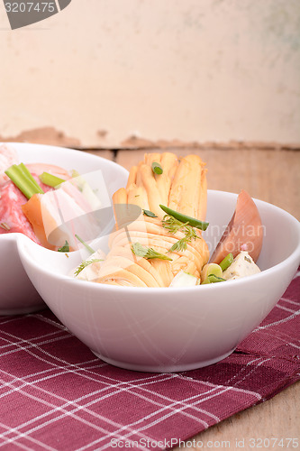 Image of salami and cheese on white plate