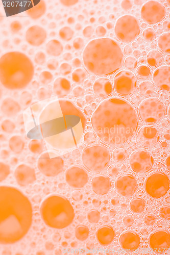 Image of orange water drops close up