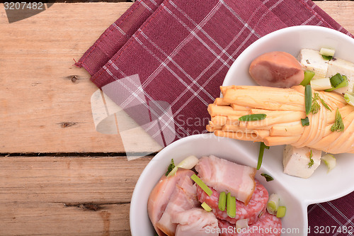 Image of salami and cheese on white plate