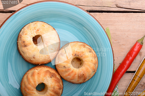 Image of cheese cake on blue plate with red pepper