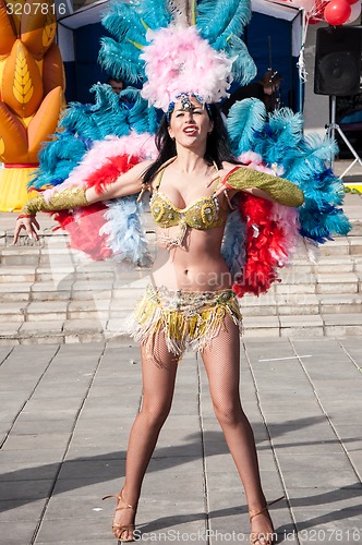 Image of Girl dancing on the street of the city