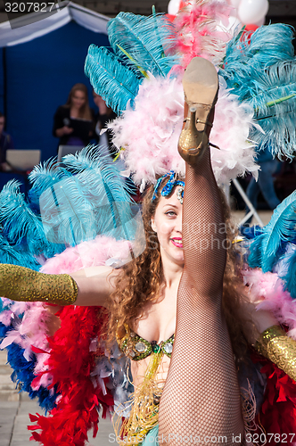 Image of Girl dancing on the street of the city