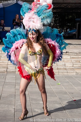 Image of Girl dancing on the street of the city