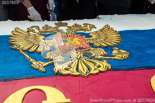 Image of A cake in the shape of the flag of Russia