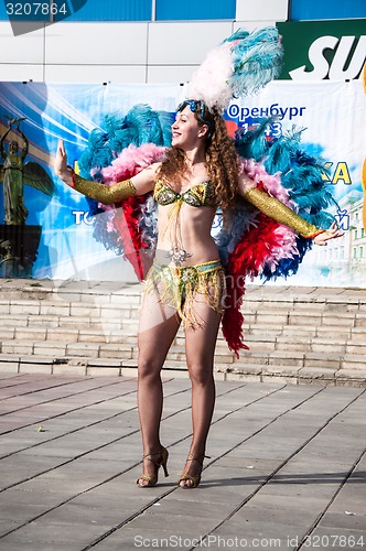 Image of Girl dancing on the street of the city