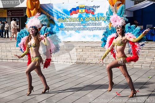 Image of Girl dancing on the street of the city