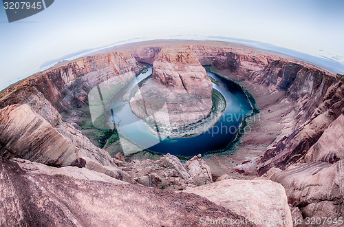 Image of horseshoe bend at sunrise with clear sky and colorado river belo