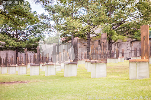 Image of The Oklahoma Bombing Monument with empty chair sculptures that m