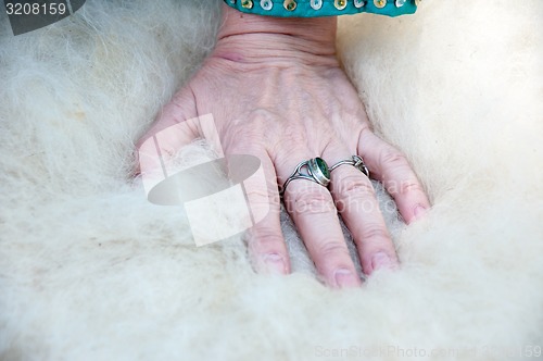 Image of Female Muslim hands works with wool